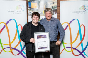 Dave Lanfear and Ieuan Hook holding a certificate looking straight at the camera