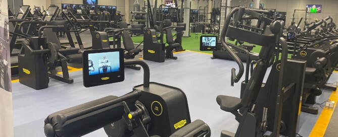 A photo of a gym showing a variety of fitness machines
